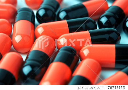 Red and black medicine capsules. Red and black medicine capsules. 76757155