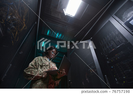 Military Network Technician Inspecting Sever Military Network Technician Inspecting Sever 76757198