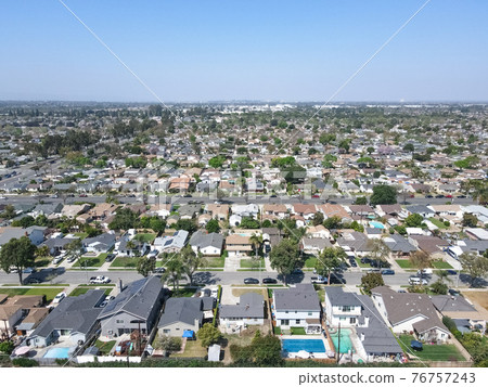 Aerial view of Lakewood middle class neighborhood, city in Los Angeles County, California 76757243