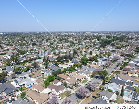 Aerial view of Lakewood middle class neighborhood, city in Los Angeles County, California 76757246
