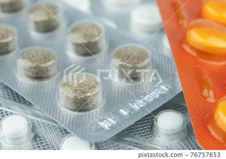 Pills in packs. 76757653