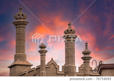 The walls and towers of the old palace on the background of beautiful pink sunset The walls and towers of the old palace on the background of beautiful pink sunset 76758095