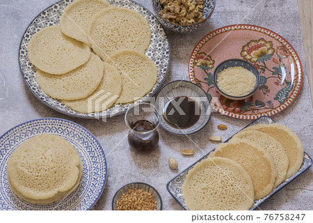 Beautiful traditional Moorish porcelain ceramic plates. illustrated middle eastern design. Marrakech Morocco 76758247