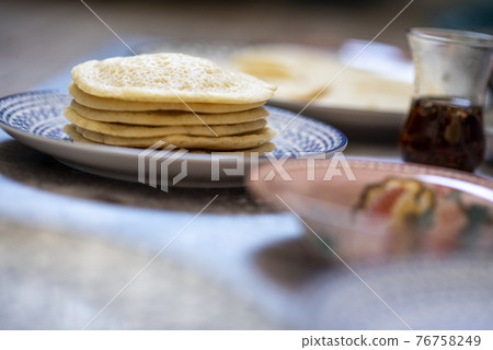 Beautiful traditional Moorish porcelain ceramic plates. illustrated middle eastern design. Marrakech Morocco 76758249