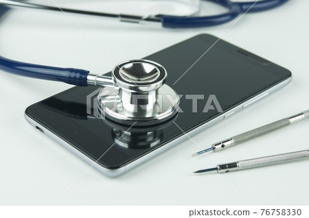 Stethoscope, smartphone and screwdrivers. 76758330