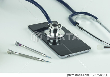 Stethoscope, smartphone and screwdrivers. 76758331