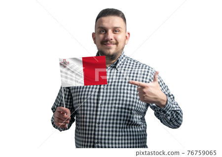 White guy holding a flag of Malta and points the finger of the other hand at the flag isolated on a white background White guy holding a flag of Malta and points the finger of the other hand at the flag isolated on a white background 76759065