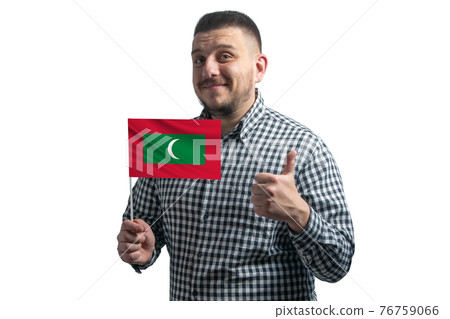 White guy holding a flag of Maldives and shows the class by hand isolated on a white background. Like for Maldives White guy holding a flag of Maldives and shows the class by hand isolated on a white background. Like for Maldives 76759066