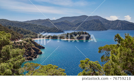 Picturesque landscape of the peninsula with Boncuklu koyu beach, view from the mountain road. Picturesque landscape of the peninsula with Boncuklu koyu beach, view from the mountain road. 76759218