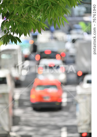 Fresh green trees (young leaves in the city), shaded roads Fresh green trees (young leaves in the city), shaded roads 76761940