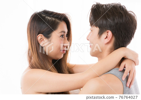couple staring at each other 76764027