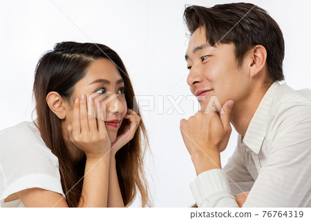 couple staring at each other 76764319