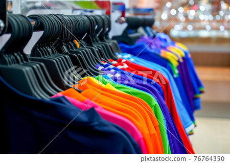sportswear hang on th the Clothesline in the sport shop. 76764350