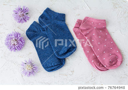 Two pair of women socks on pink background. Two pair of women socks on pink background. 76764948