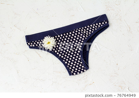Beautiful women's cotton panties on white background. Beautiful women's cotton panties on white background. 76764949