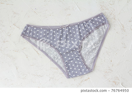 Beautiful women's cotton panties on white background. Beautiful women's cotton panties on white background. 76764950