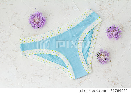 Beautiful women's cotton panties on white background. Beautiful women's cotton panties on white background. 76764951