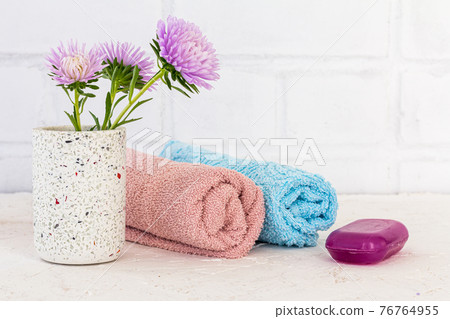 Women wash accessories and cosmetics on a white background. Women wash accessories and cosmetics on a white background. 76764955