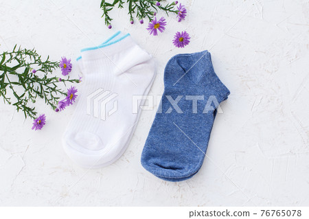 Two pairs of women socks on white background. Two pairs of women socks on white background. 76765078