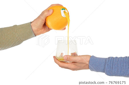 Orange juice pouring in glass Orange juice pouring in glass 76769175