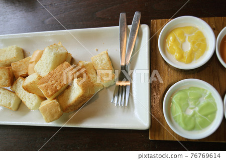 Top view of Grill Toast with Pandan custard.On wood Background. 76769614