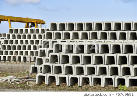 Photographed the scenery of cement factory clay pipes piled up in Setana Town, Hokkaido in spring 76769691