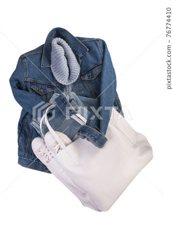 blue denim jacket, white leather sneakers, white bag on a white background. Clean branded clothing. Mock up for your design. Spring Summer Clothes blue denim jacket, white leather sneakers, white bag on a white background. Clean branded clothing. Mock up for your design. Spring Summer Clothes 76774410