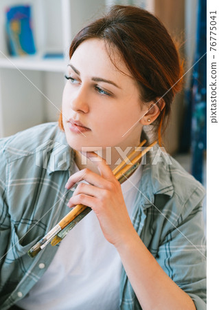 artist portrait inspired woman with paintbrushes artist portrait inspired woman with paintbrushes 76775041