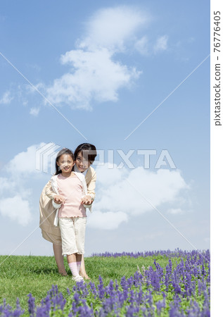 Mother and girl holding hands Mother and girl holding hands 76776405