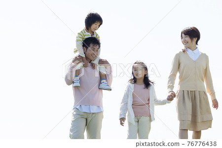 Families taking a walk 76776438