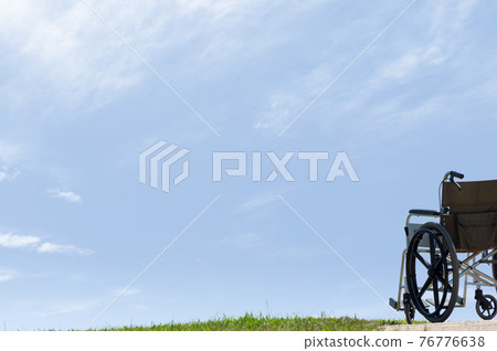 Blue sky and wheelchair Blue sky and wheelchair 76776638
