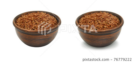 brown rice in clay bowl on white background, isolated and with shadow brown rice in clay bowl on white background, isolated and with shadow 76779222