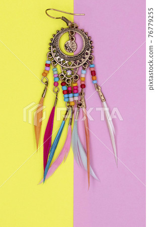 Ethnic decorations on colored sheets of paper. Ethnic decorations on colored sheets of paper. 76779255