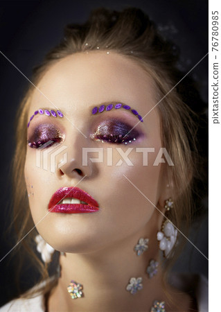 Model girl with bright makeup with eyes closed. Fashion makeup.Face with red lips. Model girl with bright makeup with eyes closed. Fashion makeup.Face with red lips. 76780985