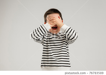 Caucasian boy isolated on white studio background. Copyspace. Childhood, education, emotions concept Caucasian boy isolated on white studio background. Copyspace. Childhood, education, emotions concept 76783589