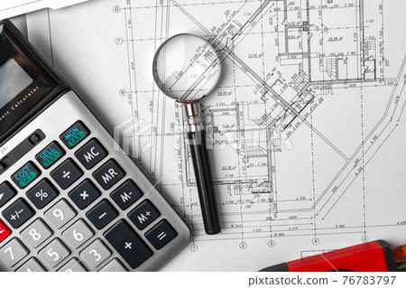 Architectural construction plans paper on table close up Architectural construction plans paper on table close up 76783797