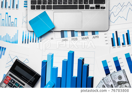Financial paper with charts and diagrams on gray table Financial paper with charts and diagrams on gray table 76783808