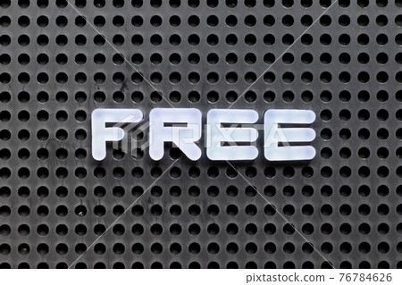 White color letter in word free on black pegboard background White color letter in word free on black pegboard background 76784626