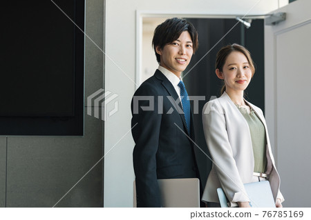 Young male and female business person portrait Young male and female business person portrait 76785169