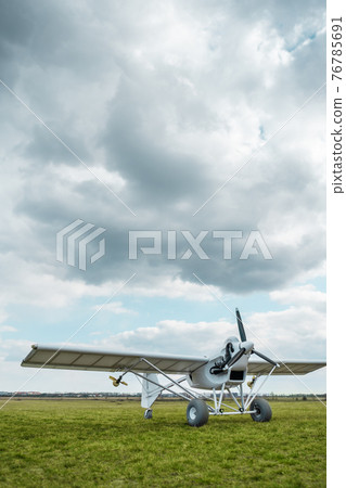 remote controlled agriculture spaying air plane in field at sunset, no people remote controlled agriculture spaying air plane in field at sunset, no people 76785691