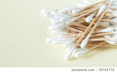 Bamboo cotton swabs or buds top view on beige background 76785778