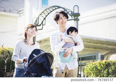 Walking family of three 76786537