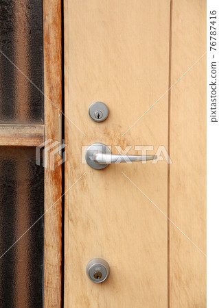 Wooden entrance door with deteriorated paint (before repainting) Wooden entrance door with deteriorated paint (before repainting) 76787416