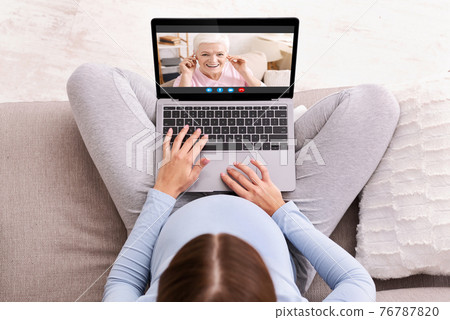 Unrecognizable Pregnant Lady Making Video Call On Laptop To Her Elderly Mother 76787820