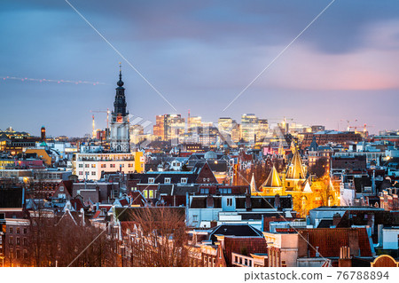 Amsterdam, Netherlands historic cityscape with the modern Zuidas district 76788894