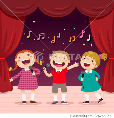 Children sing with a microphone on the stage 76788967