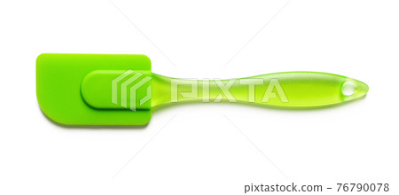 Green cooking silicone spatula isolated on white backgrounds. Green cooking silicone spatula isolated on white backgrounds. 76790078