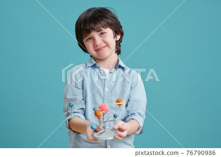 Little boy with toy Little boy with toy 76790986