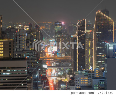 Aerial view of Bangkok Downtown Skyline, Thailand. Financial district and business centers in smart urban city in Asia. Skyscraper and high-rise buildings at night. 76791730
