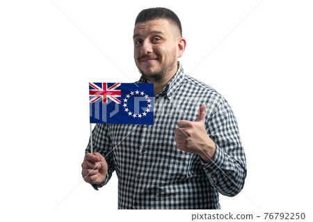 White guy holding a flag of Cook Islands and shows the class by hand isolated on a white background. Like for Cook Islands White guy holding a flag of Cook Islands and shows the class by hand isolated on a white background. Like for Cook Islands 76792250